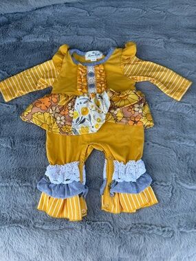 Mustard Floral Ruffle Baby Romper by Marie Nicole